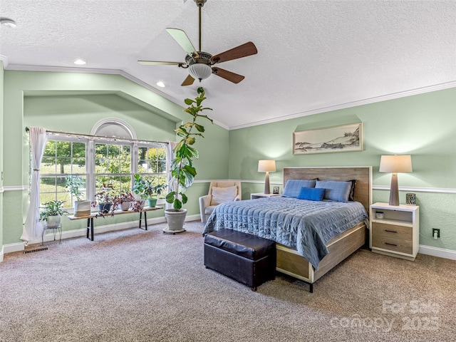 bedroom featuring lofted ceiling, a textured ceiling, ornamental molding, and carpet flooring