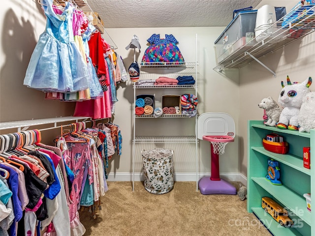 spacious closet with carpet flooring