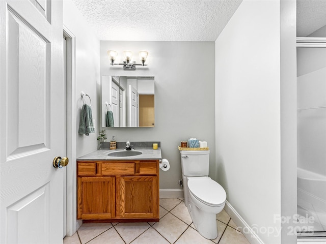 bathroom featuring toilet, a textured ceiling, tile patterned flooring, walk in shower, and vanity