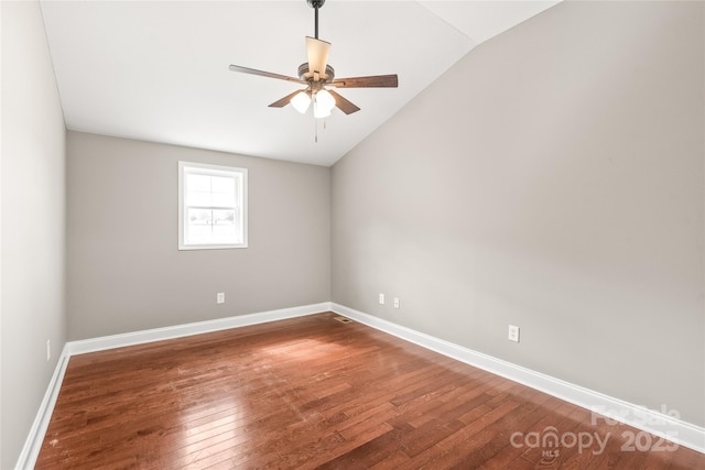 unfurnished room featuring ceiling fan, baseboards, lofted ceiling, and hardwood / wood-style flooring