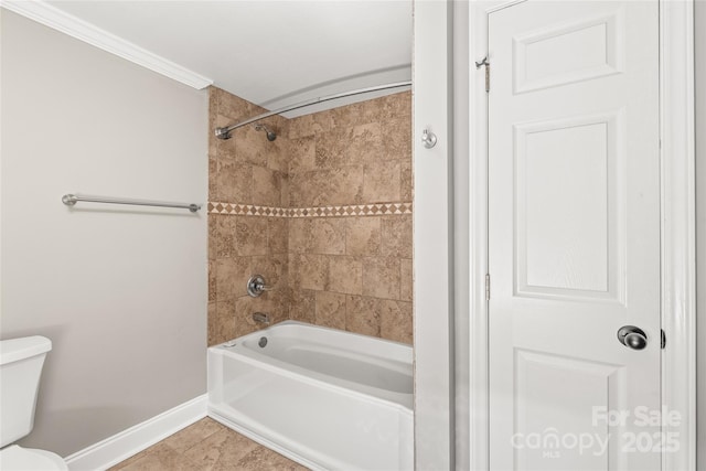 full bathroom featuring tile patterned flooring, toilet, tub / shower combination, and baseboards