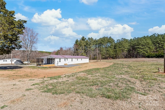 view of yard featuring a sunroom