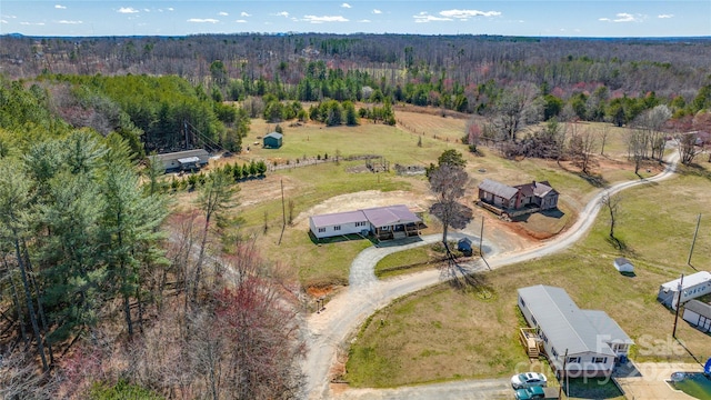 bird's eye view with a forest view and a rural view