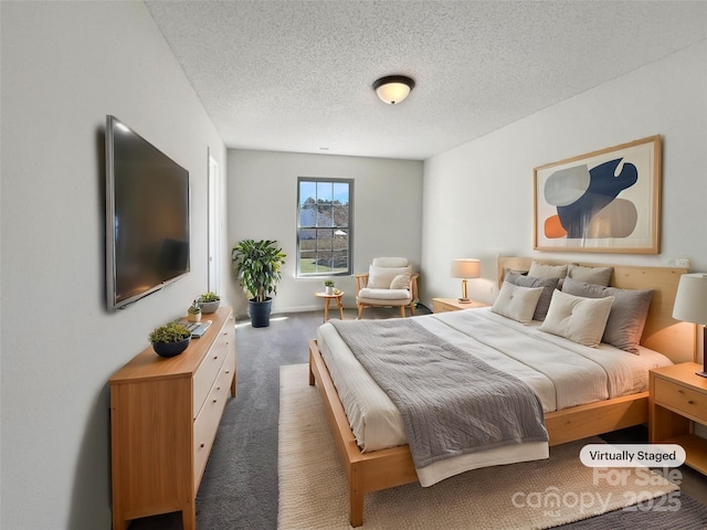 bedroom with carpet flooring and a textured ceiling