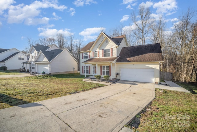 traditional-style home featuring driveway, a front lawn, and a garage