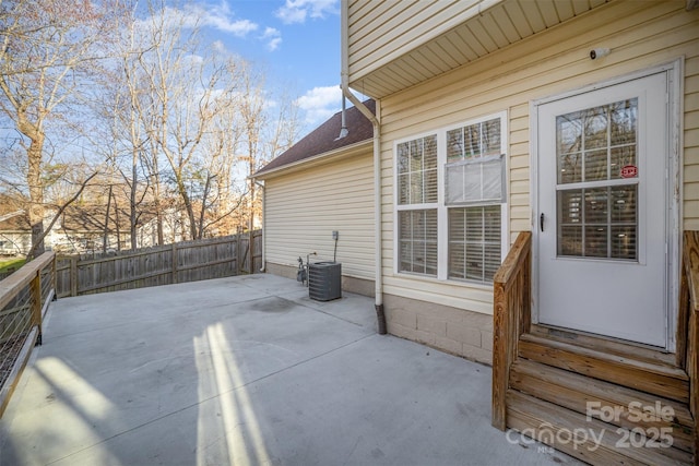 view of patio featuring entry steps, cooling unit, and fence