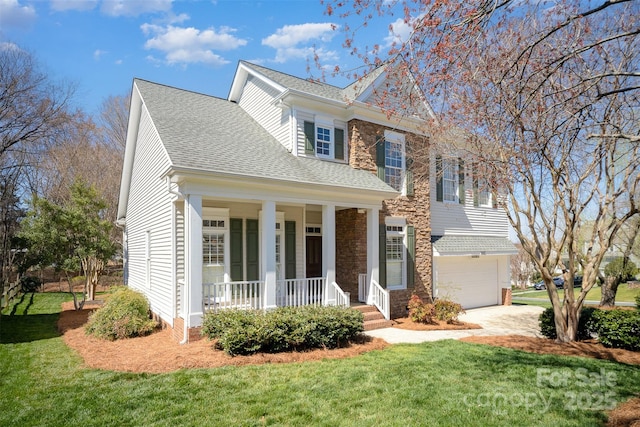 view of front facade featuring a garage, a shingled roof, a porch, and a front yard