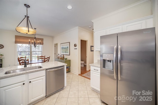 kitchen with crown molding, white cabinets, appliances with stainless steel finishes, a sink, and light tile patterned floors