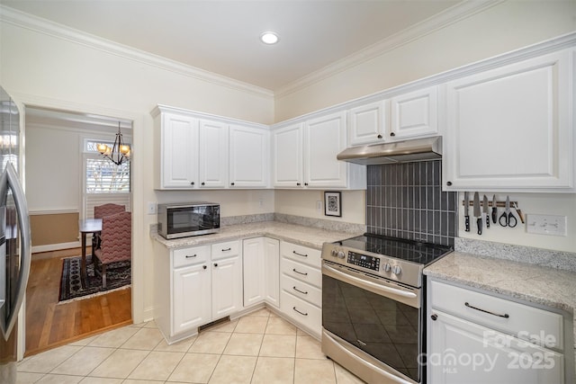 kitchen featuring under cabinet range hood, white cabinets, a chandelier, ornamental molding, and stainless steel appliances