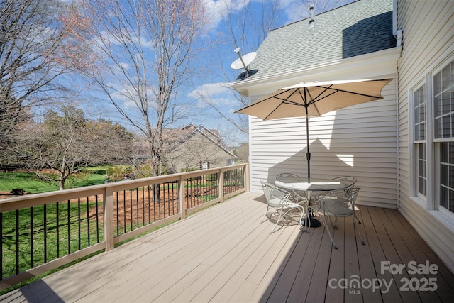 deck featuring outdoor dining space