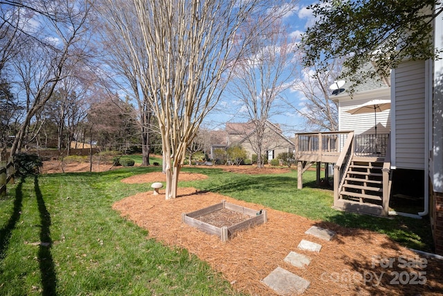 view of yard with a wooden deck and stairs
