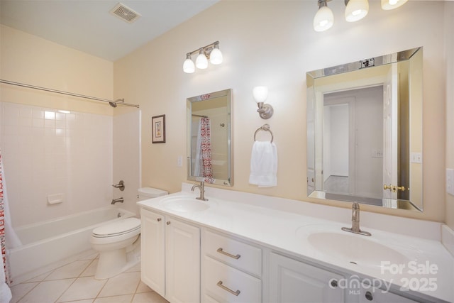 full bath featuring visible vents, tile patterned flooring, double vanity, toilet, and a sink