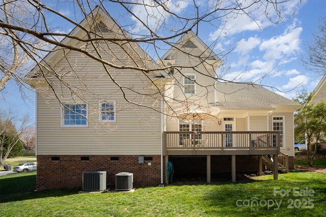 rear view of house featuring a wooden deck, a yard, crawl space, and cooling unit