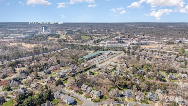 birds eye view of property with a residential view