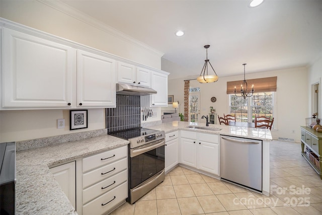 kitchen featuring a peninsula, under cabinet range hood, white cabinets, a sink, and stainless steel appliances