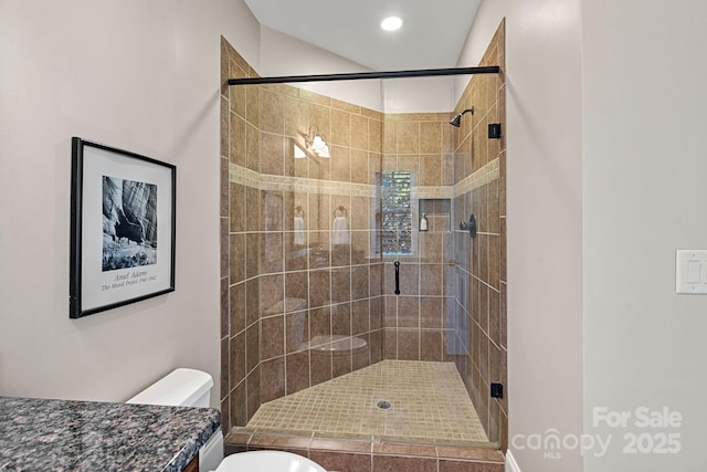 full bathroom featuring recessed lighting, a stall shower, toilet, and vanity