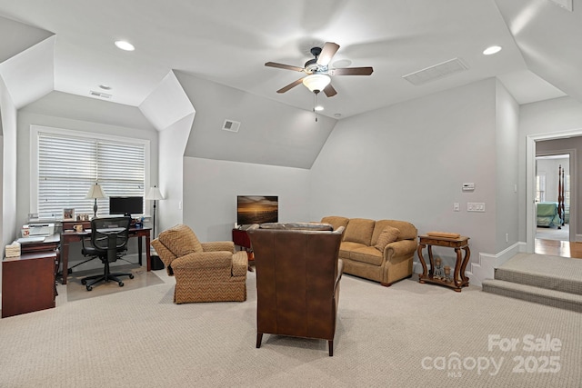 interior space featuring lofted ceiling, carpet, and visible vents