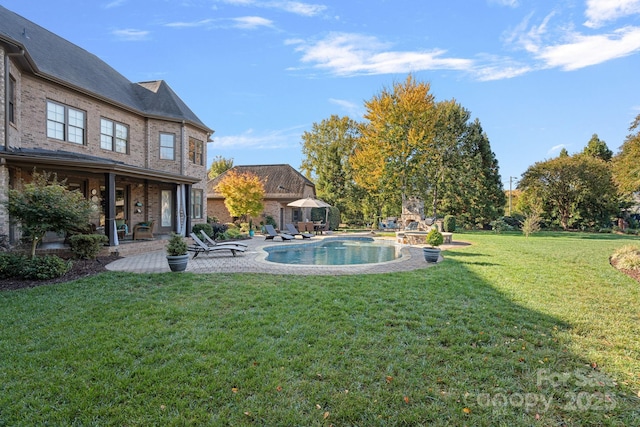 view of yard with an outdoor pool and a patio area