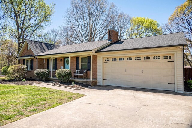 ranch-style home with brick siding, a porch, a chimney, a garage, and driveway