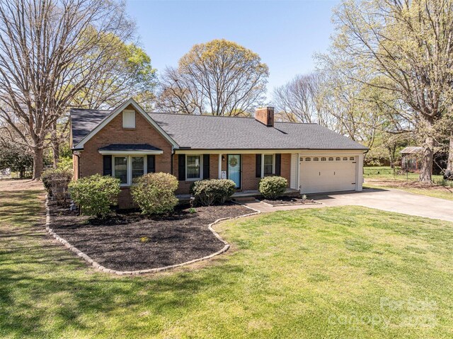 single story home featuring a front lawn, brick siding, concrete driveway, and a chimney