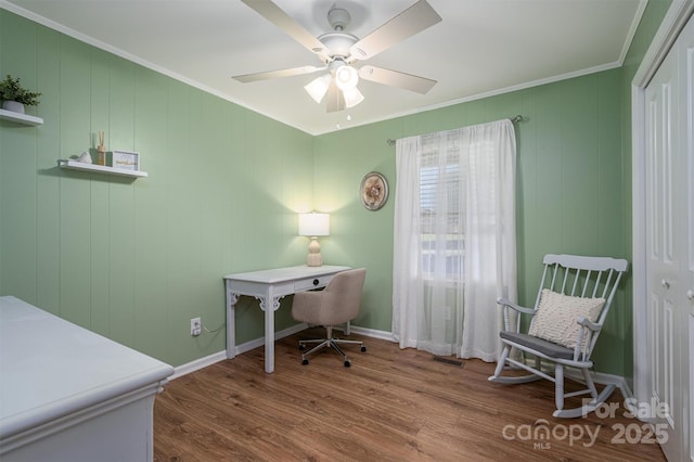 office featuring visible vents, crown molding, baseboards, wood finished floors, and a ceiling fan