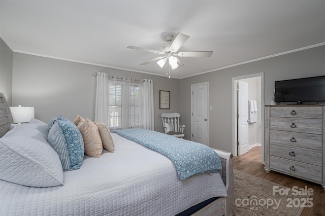 bedroom featuring crown molding, dark wood-style floors, baseboards, and ceiling fan