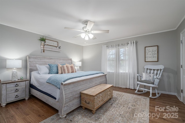 bedroom with crown molding, wood finished floors, baseboards, and ceiling fan