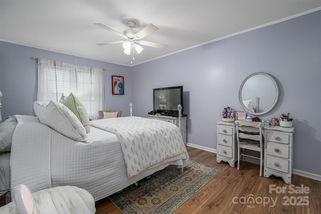 bedroom with baseboards, wood finished floors, and crown molding