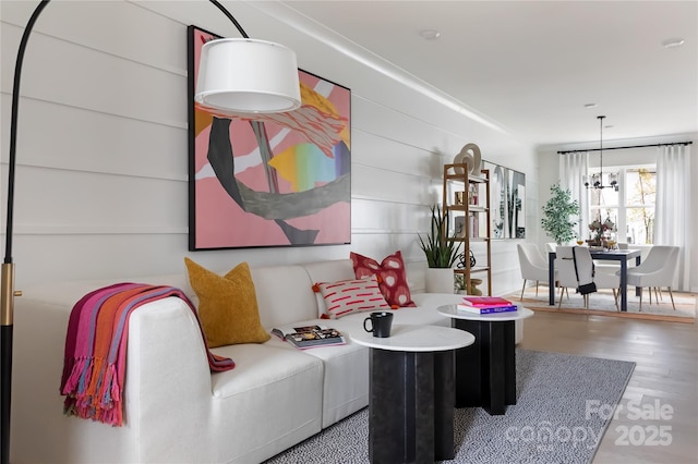 interior space featuring an inviting chandelier and wood finished floors