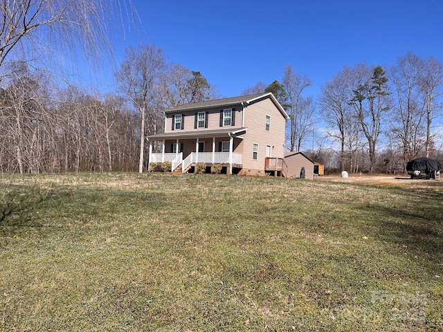 back of property featuring crawl space, covered porch, and a lawn