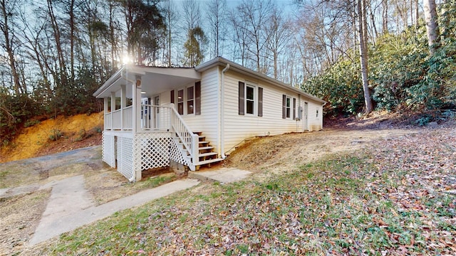 exterior space with covered porch and driveway