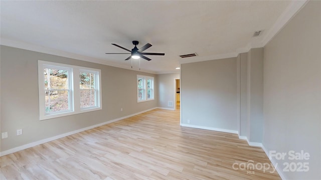 unfurnished room with baseboards, visible vents, light wood-style flooring, ceiling fan, and crown molding