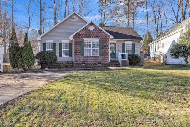 view of front of house with crawl space, brick siding, and a front yard