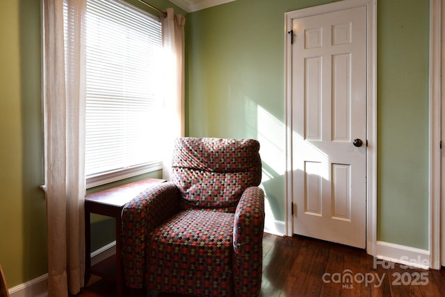 sitting room featuring a wealth of natural light, baseboards, and dark wood-type flooring