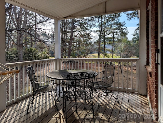 wooden deck with outdoor dining area