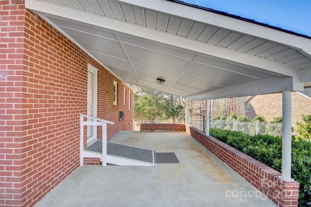 view of patio featuring fence