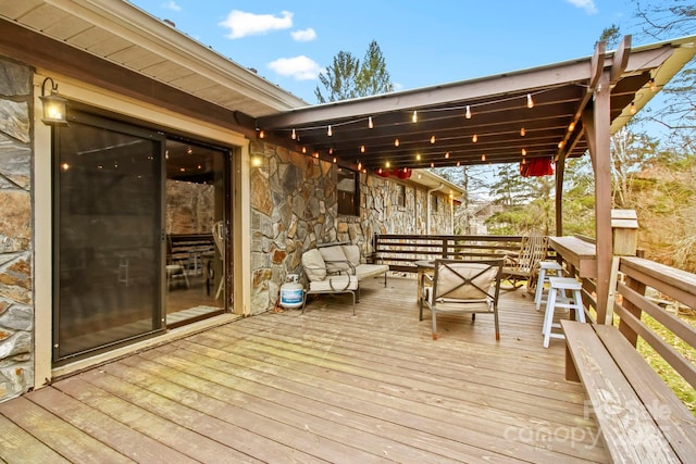 wooden deck featuring an outdoor hangout area