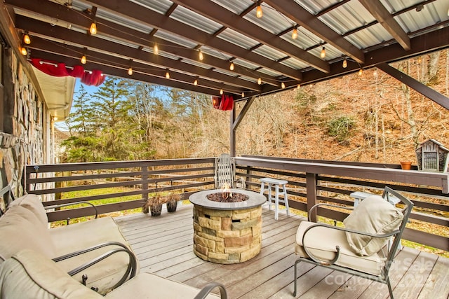 deck featuring an outdoor fire pit