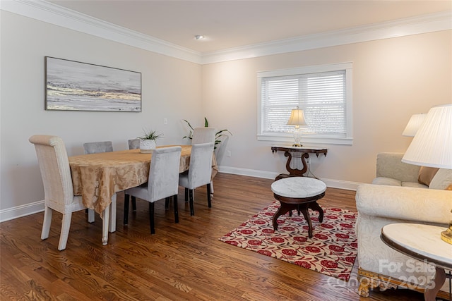 dining space with wood finished floors, baseboards, and ornamental molding