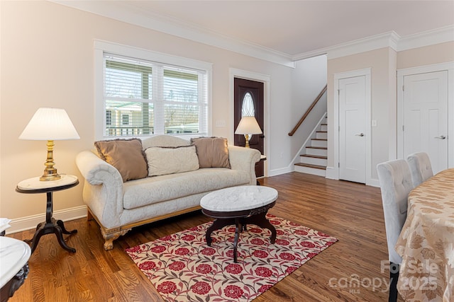 living room with crown molding, stairway, wood finished floors, and baseboards