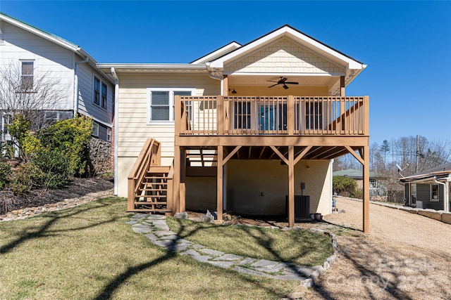 rear view of house featuring a yard, a wooden deck, stairs, and ceiling fan