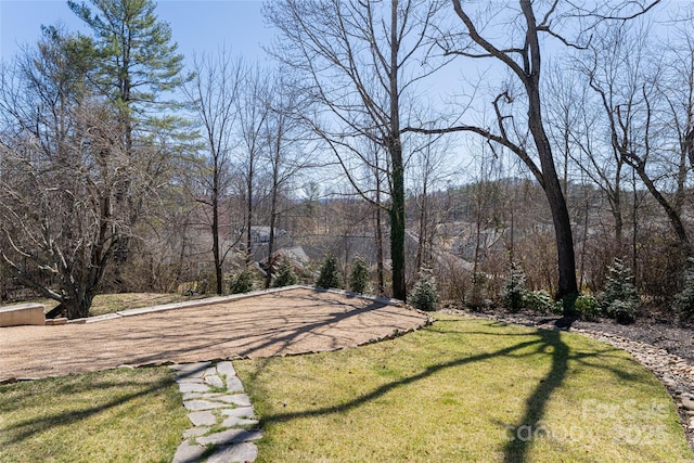 exterior space featuring a wooded view