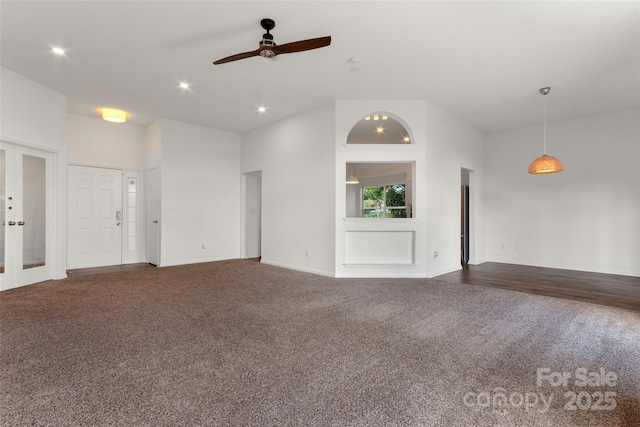 unfurnished living room with baseboards, recessed lighting, ceiling fan, french doors, and dark carpet