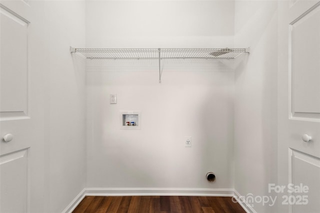 washroom with dark wood-style flooring, baseboards, hookup for an electric dryer, hookup for a washing machine, and laundry area