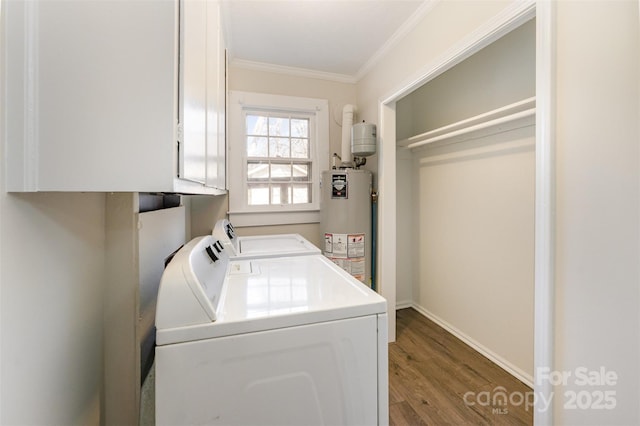 clothes washing area featuring wood finished floors, cabinet space, crown molding, gas water heater, and independent washer and dryer