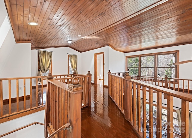 corridor with an upstairs landing, vaulted ceiling, wooden ceiling, and wood-type flooring