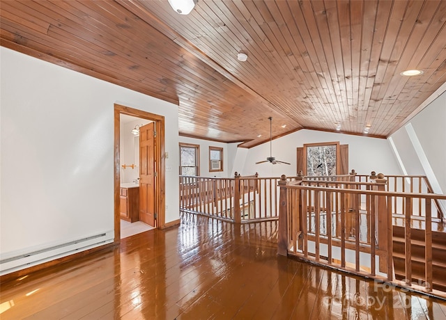 bonus room featuring a wealth of natural light, wood-type flooring, a baseboard radiator, lofted ceiling, and wood ceiling