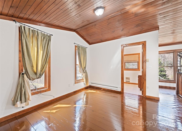 spare room with a baseboard heating unit, vaulted ceiling, baseboards, and wood-type flooring