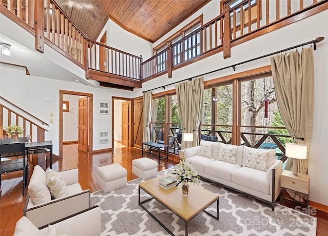 50 Cottontail Ln, Canton, NC 28716 - living room featuring hardwood / wood-style floors, stairway, wooden ceiling, a towering ceiling, and baseboards