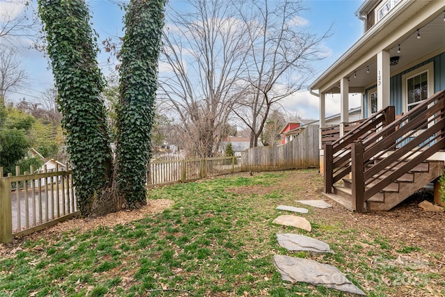 view of yard with a fenced backyard